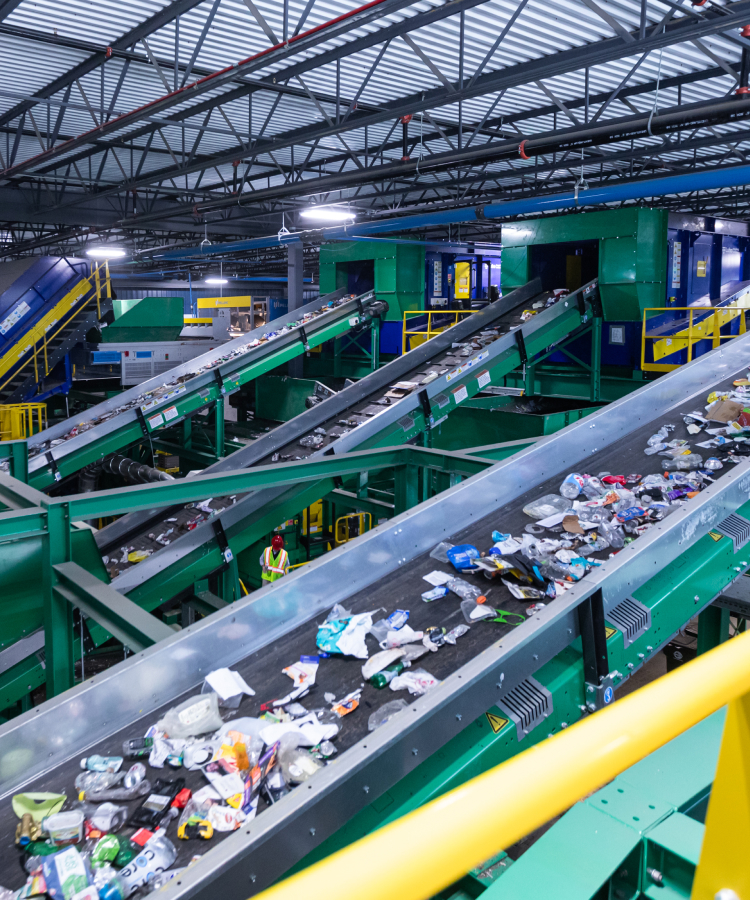 6764ff4048154505536c0eec_Portrait_Large-scale conveyor belts sorting commercial waste for recycling services